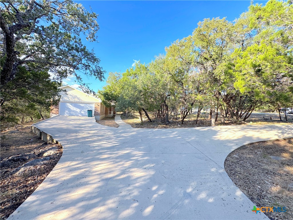 4575 Tanglewood Trail Spring Branch, TX 78070 - Photo 33 of 48 a view of road with trees