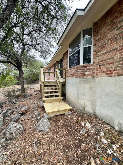 4575 Tanglewood Trail Spring Branch, TX 78070 - Photo 44 of 48 a view of a house with backyard and trees