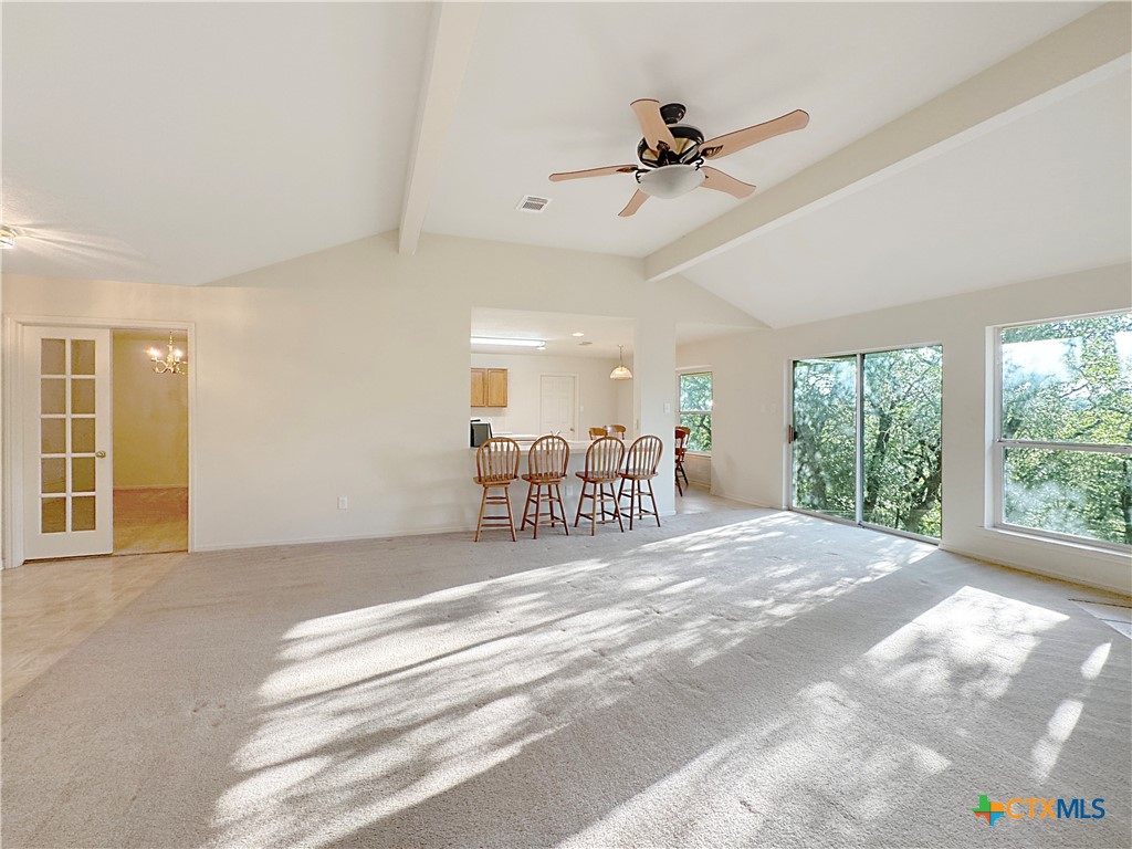 4575 Tanglewood Trail Spring Branch, TX 78070 - Photo 8 of 48 a view of a livingroom with a ceiling fan and windows