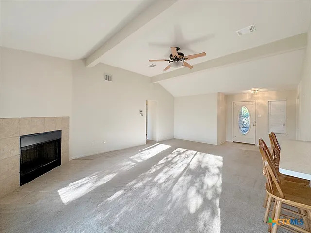 a view of workspace with furniture and fireplace