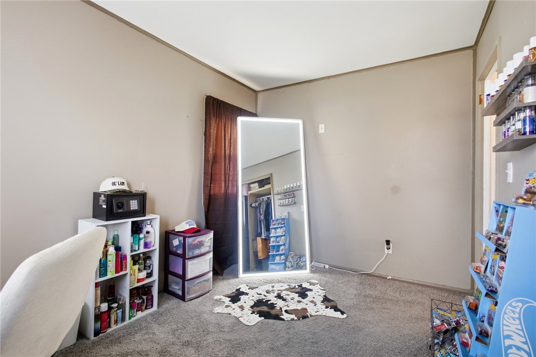 2745 Share Street Springfield, OH 45505 - Photo 22 of 28 This cozy bedroom features plush carpet flooring, offering comfort and warmth to the space.