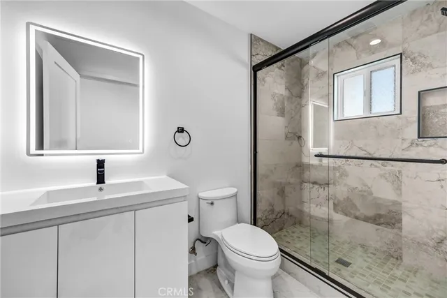 a bedroom with two beds and a couch