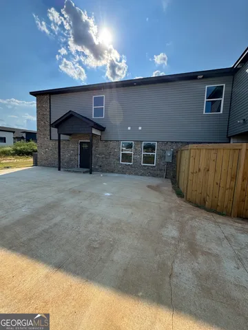 a view of an empty room with a fireplace