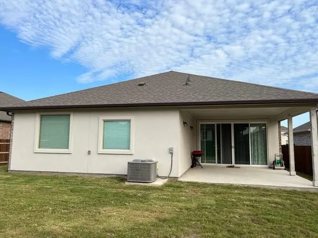 a view of a house with pool table and chairs
