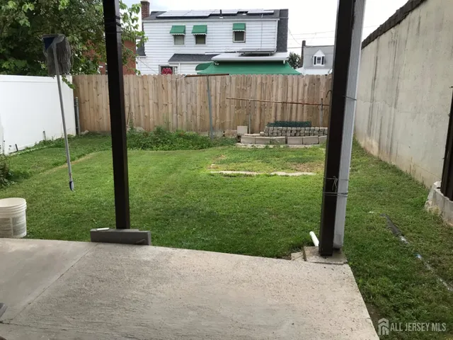 a view of a back yard of the house