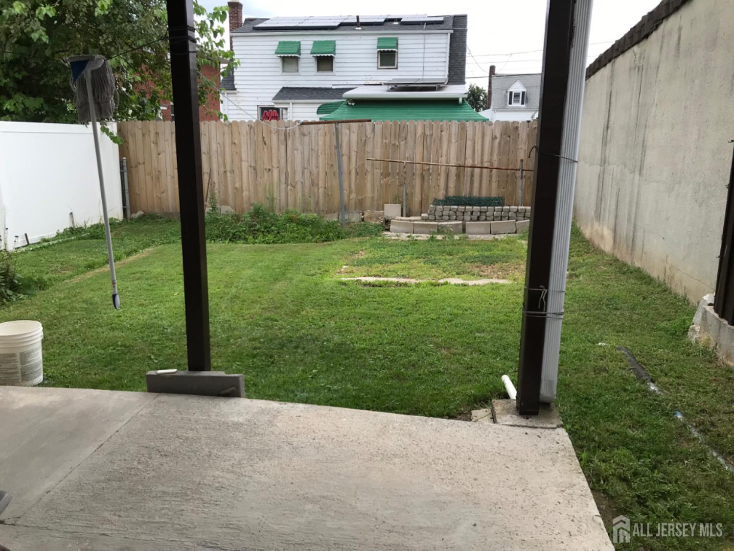 689 Mary Street Perth Amboy, NJ 08861 - Photo 15 of 24 a view of a back yard of the house