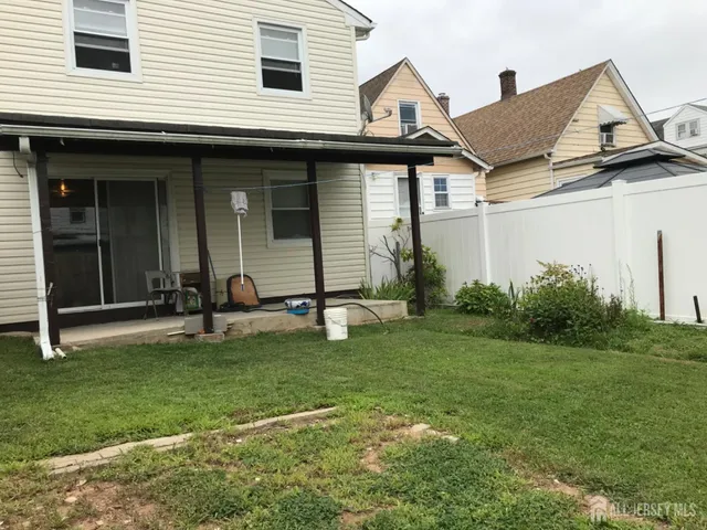 a bedroom with a bed and a mirror