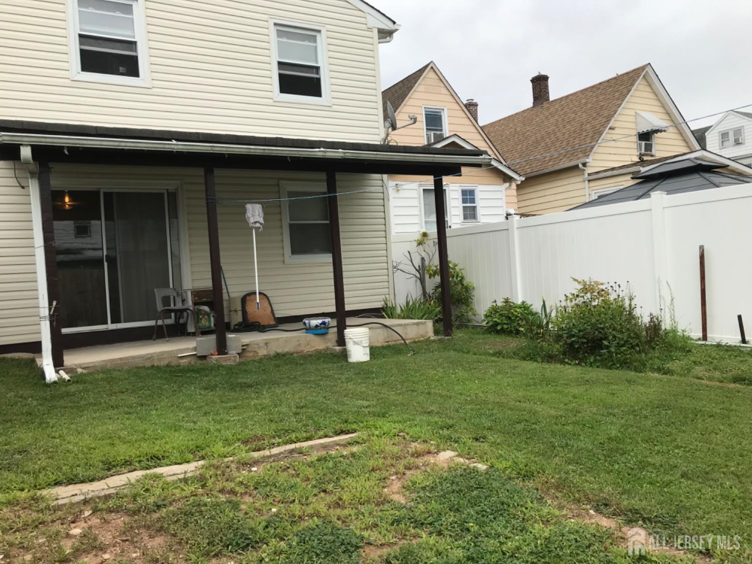 689 Mary Street Perth Amboy, NJ 08861 - Photo 17 of 24 a view of a house with a backyard