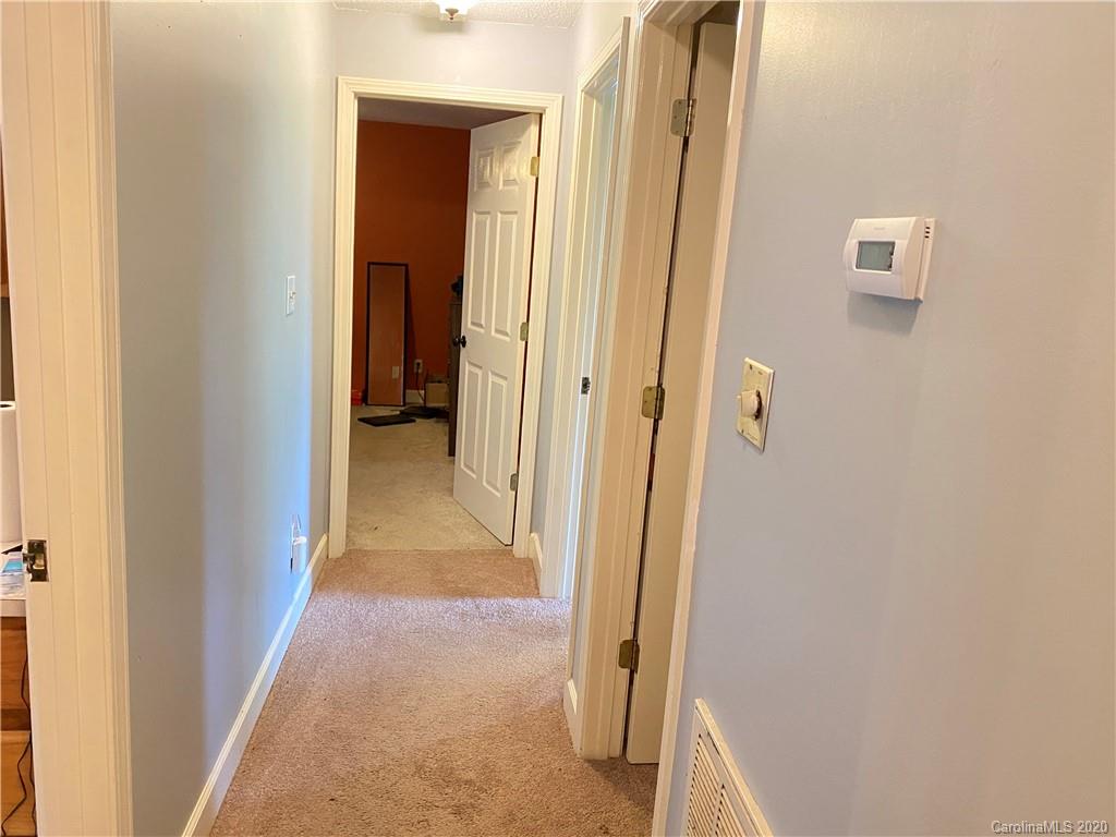 3301 Back Creek Church Road Charlotte, NC 28213 - Photo 21 of 30 a view of a hallway with wooden floor and a bathroom