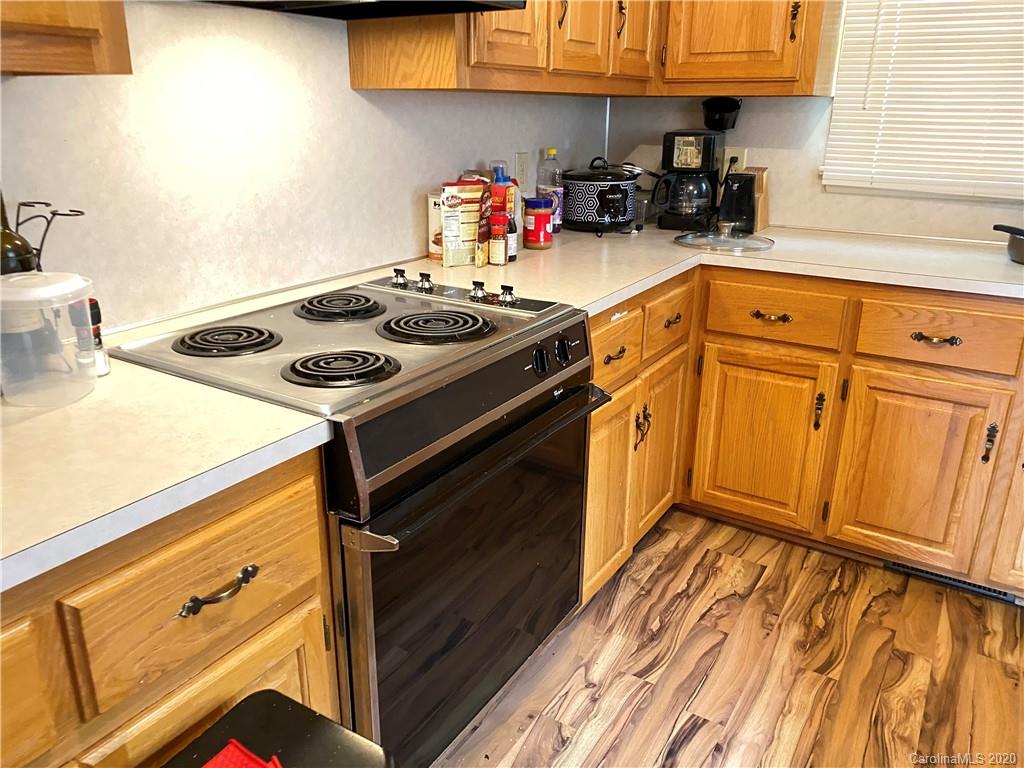 3301 Back Creek Church Road Charlotte, NC 28213 - Photo 10 of 30 a kitchen with granite countertop a stove and a sink