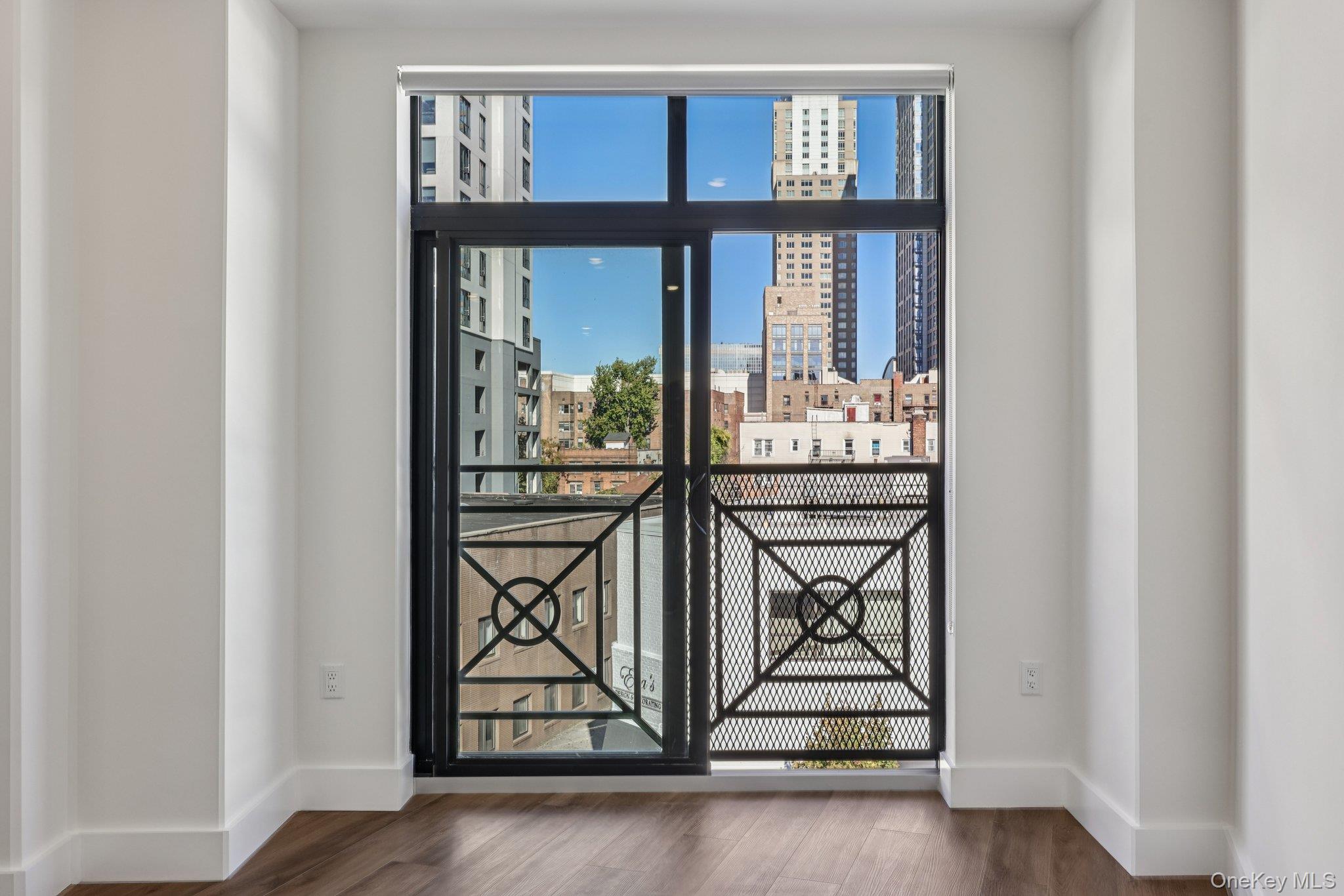 199 East Post Road, Unit 202 White Plains, NY 10601 - Photo 17 of 21 a view of a entryway door with wooden floor