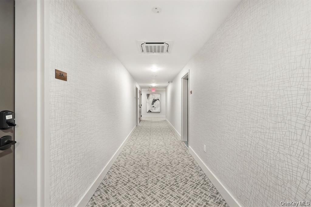 199 East Post Road, Unit 202 White Plains, NY 10601 - Photo 8 of 21 a view of a hallway