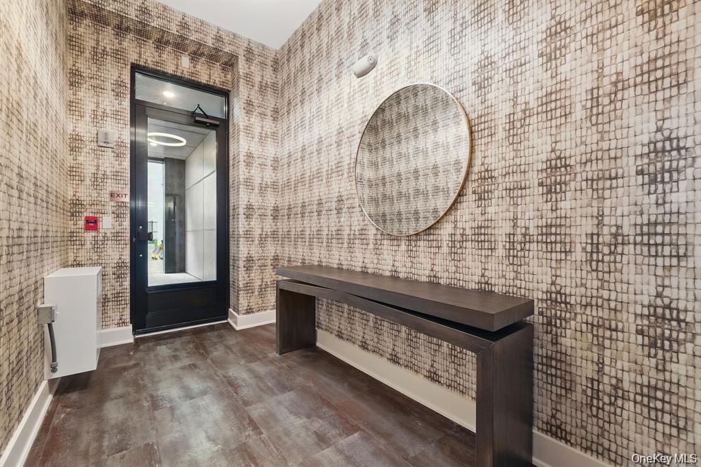 199 East Post Road, Unit 202 White Plains, NY 10601 - Photo 9 of 21 a view of an entryway with wooden floor and door