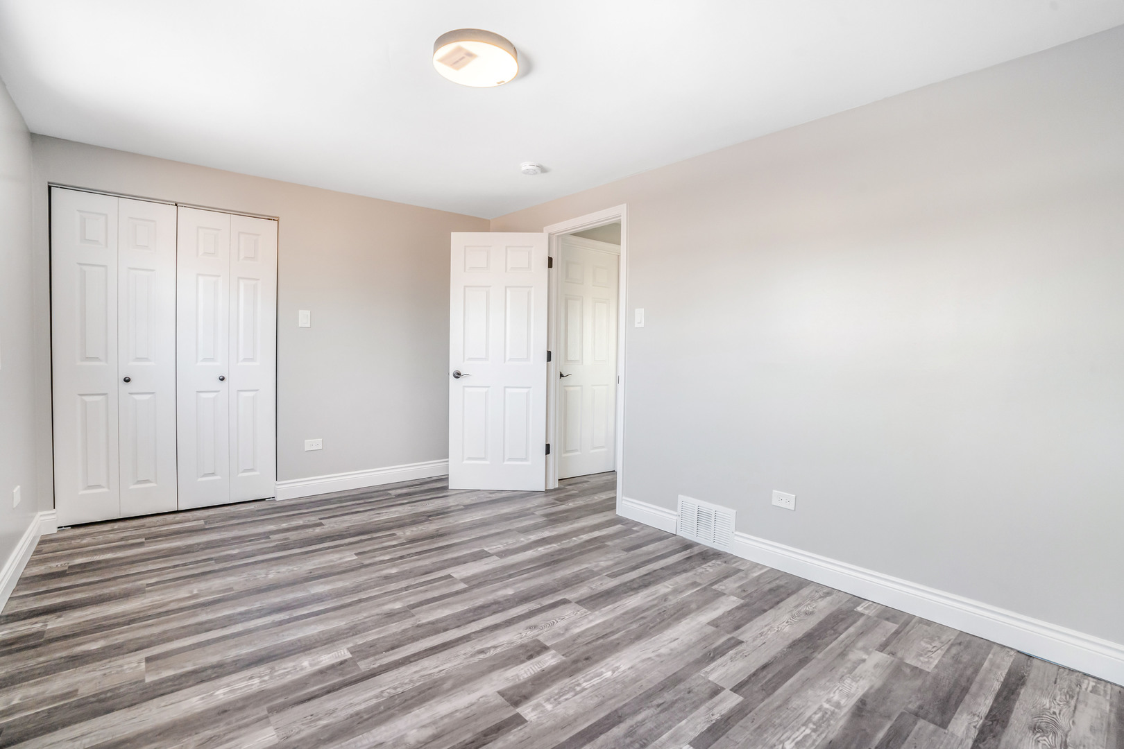 13049 South Brandon Avenue Chicago, IL 60633 - Photo 14 of 20 a view of an empty room with wooden floor