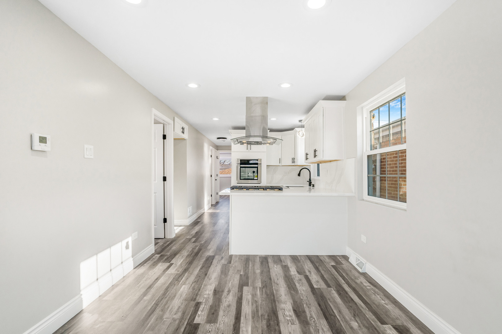 13049 South Brandon Avenue Chicago, IL 60633 - Photo 4 of 20 a view of kitchen and wooden floor
