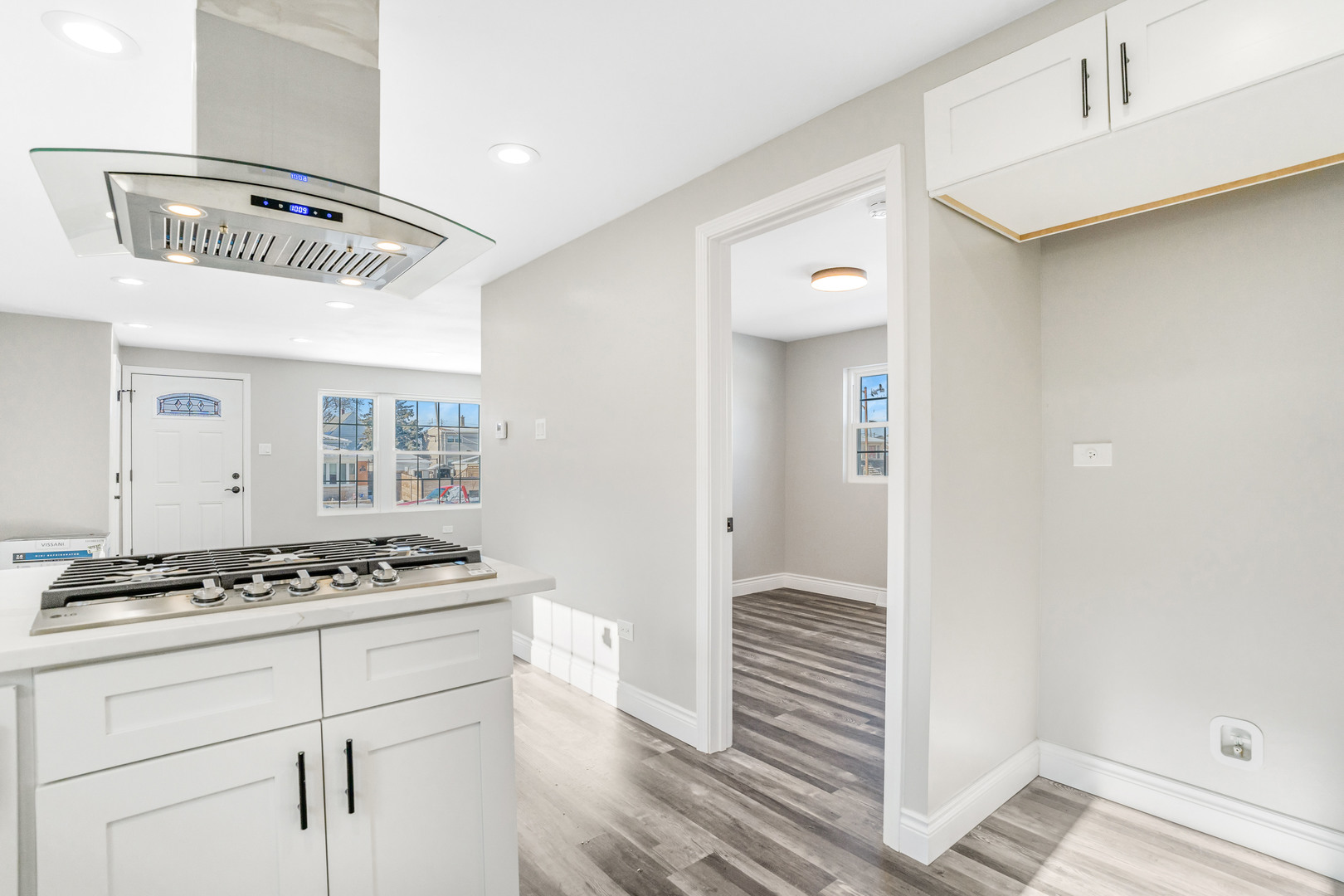 13049 South Brandon Avenue Chicago, IL 60633 - Photo 8 of 20 a view of kitchen cabinetry and wooden floor