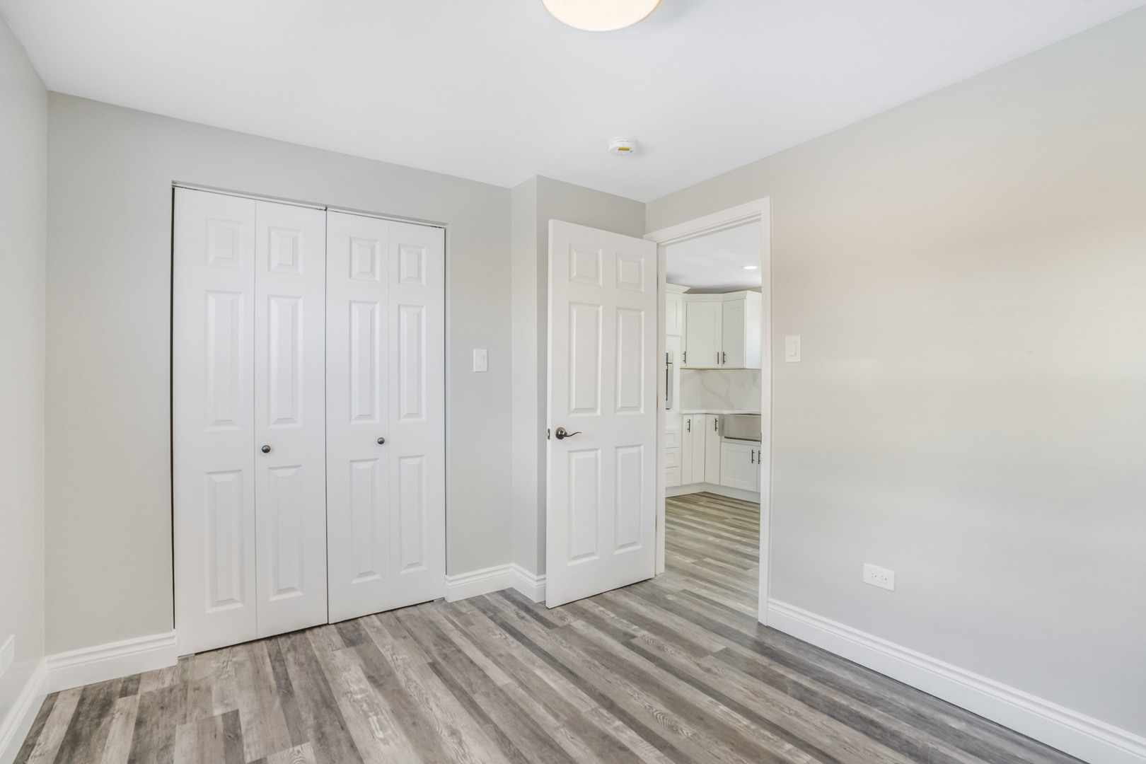 13049 South Brandon Avenue Chicago, IL 60633 - Photo 9 of 20 a view of wooden floor and windows in a room