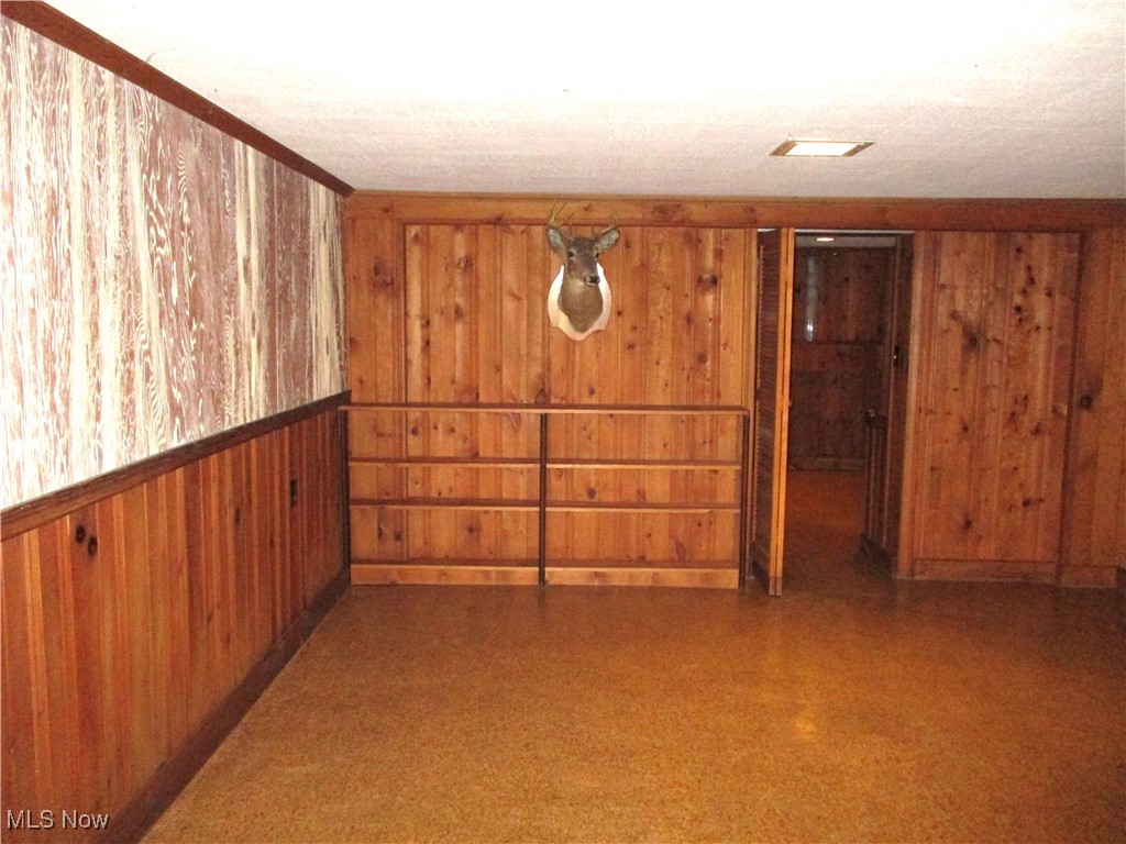 2380 West Pleasant Valley Road Parma, OH 44134 - Photo 21 of 38 Rec room with wood walls built in shelves