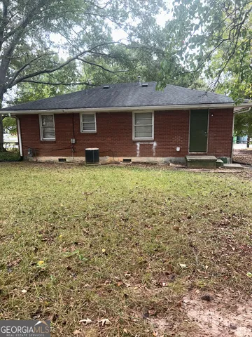 a backyard of a house with seating space
