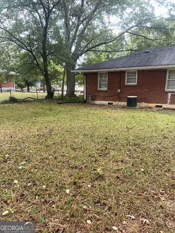 a backyard of a house with lots of green space