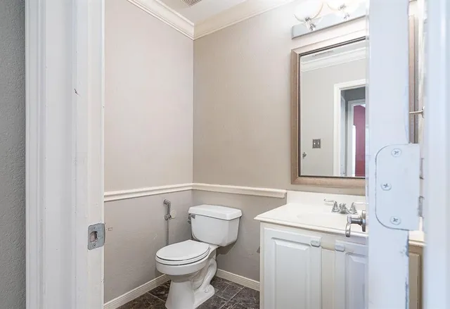 a bathroom with a sink toilet and vanity