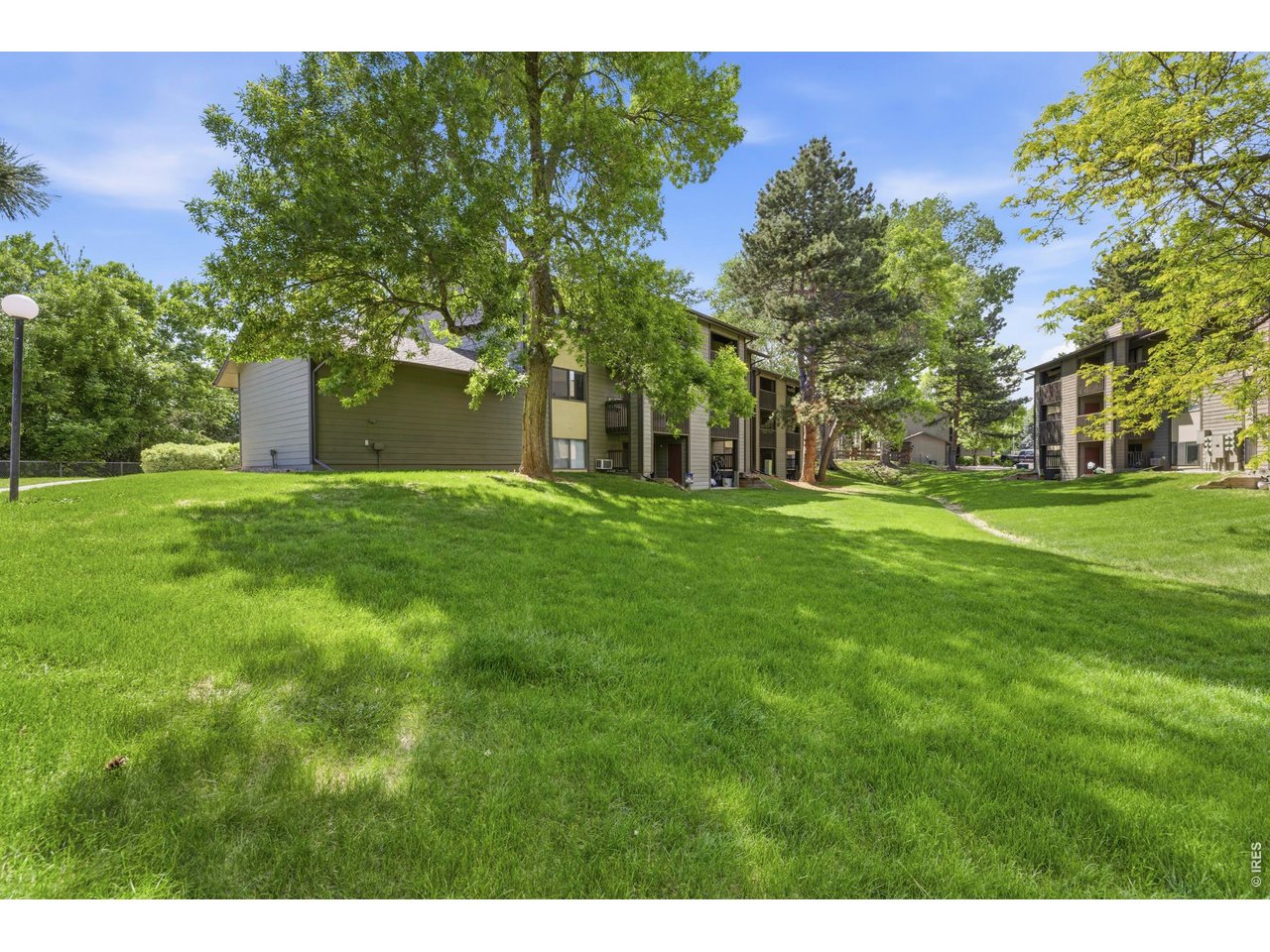 925 Columbia Road, Unit 824 Fort Collins, CO 80525 - Photo 23 of 36 a view of a house with a big yard