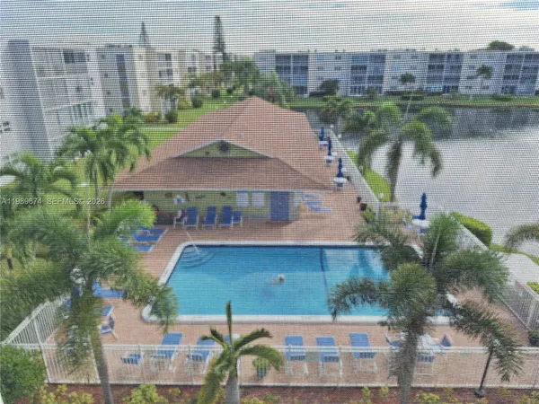 an aerial view of a house with lake view