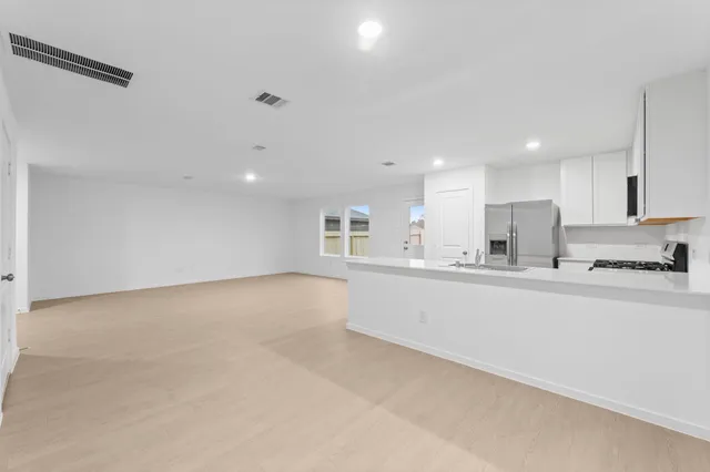 a view of counter top and kitchen