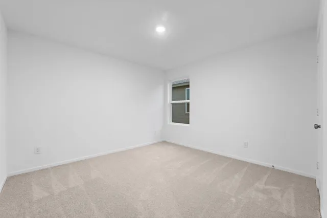 an empty room with a empty space and window