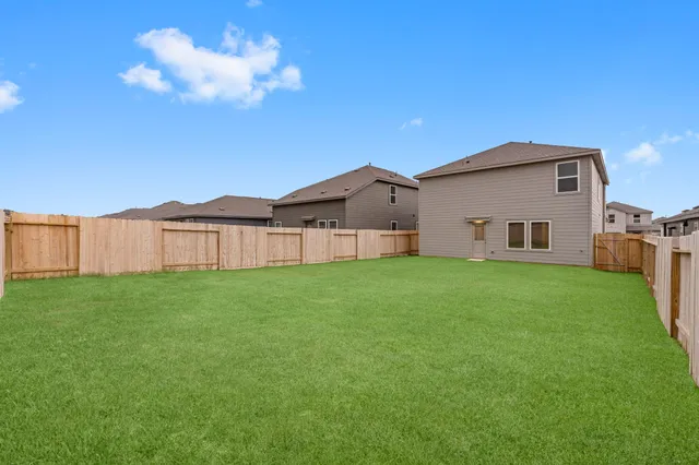 a view of a house with a back yard