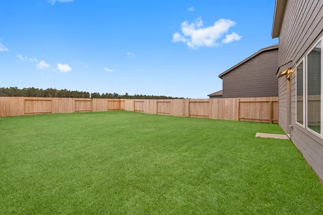a view of a backyard with a lake view