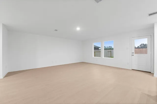 an empty room with windows