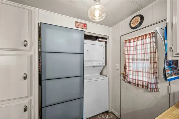 a white refrigerator freezer sitting inside of a kitchen