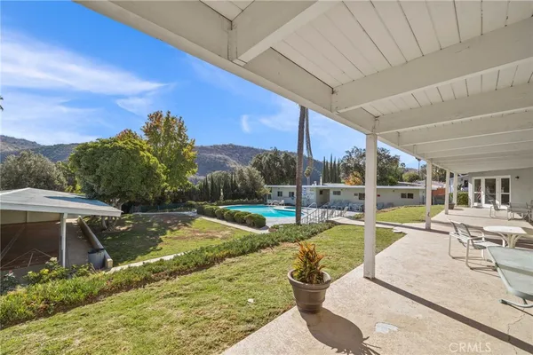 a view of a swimming pool with a patio