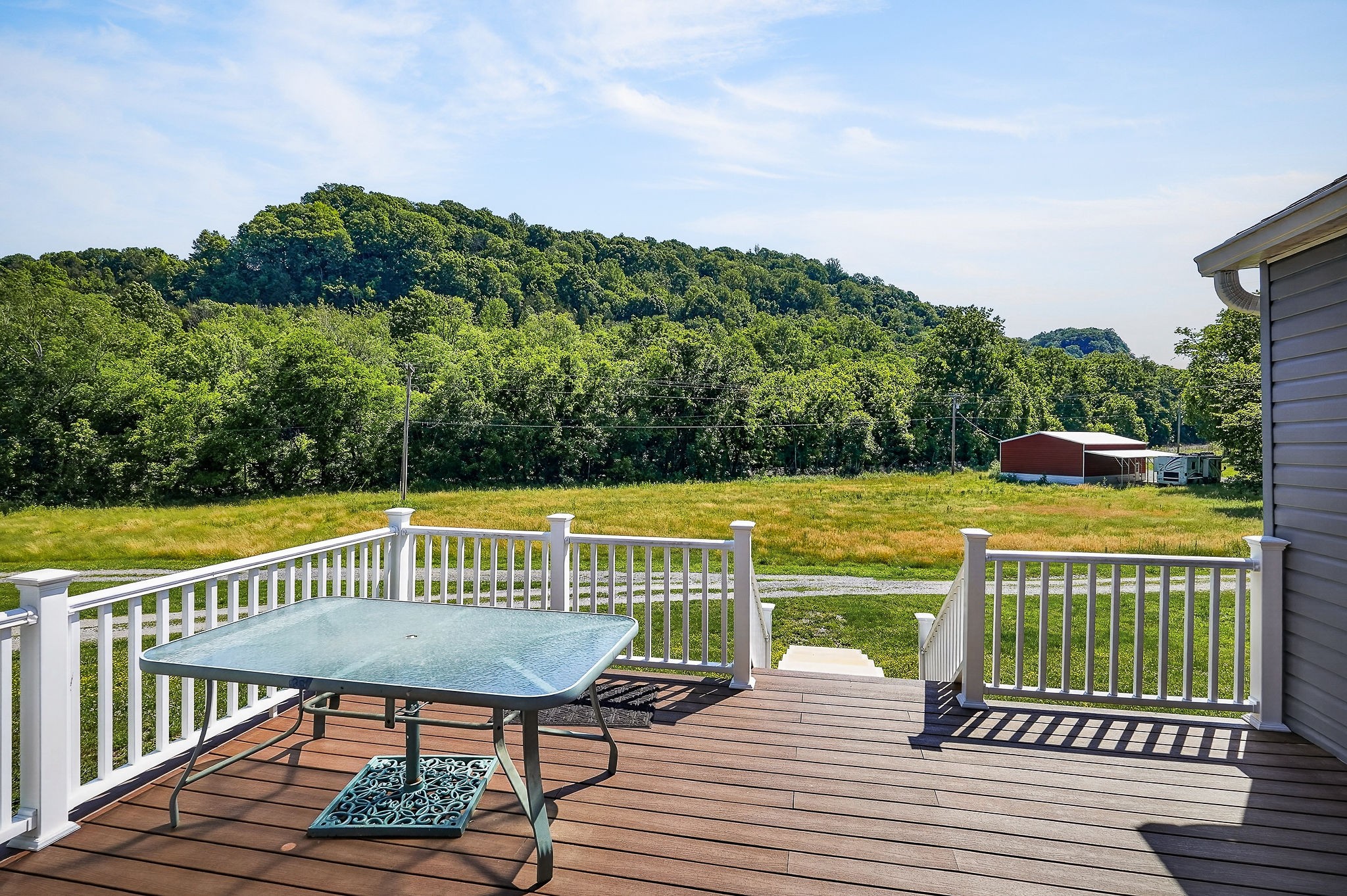 16062 Buffalo Valley Road Silver Point, TN 38582 - Photo 4 of 27 a view of a roof deck with wooden floor and fence