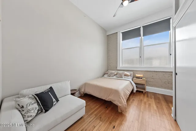 a kitchen with kitchen island a counter top space a sink and stainless steel appliances