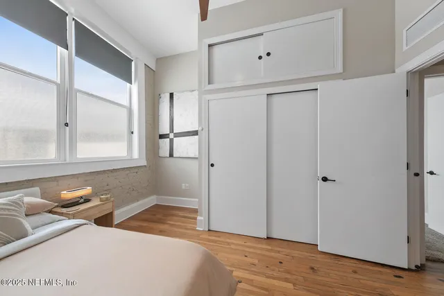 a bedroom with a bed and window