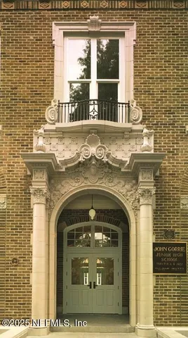 front of a building with a yard