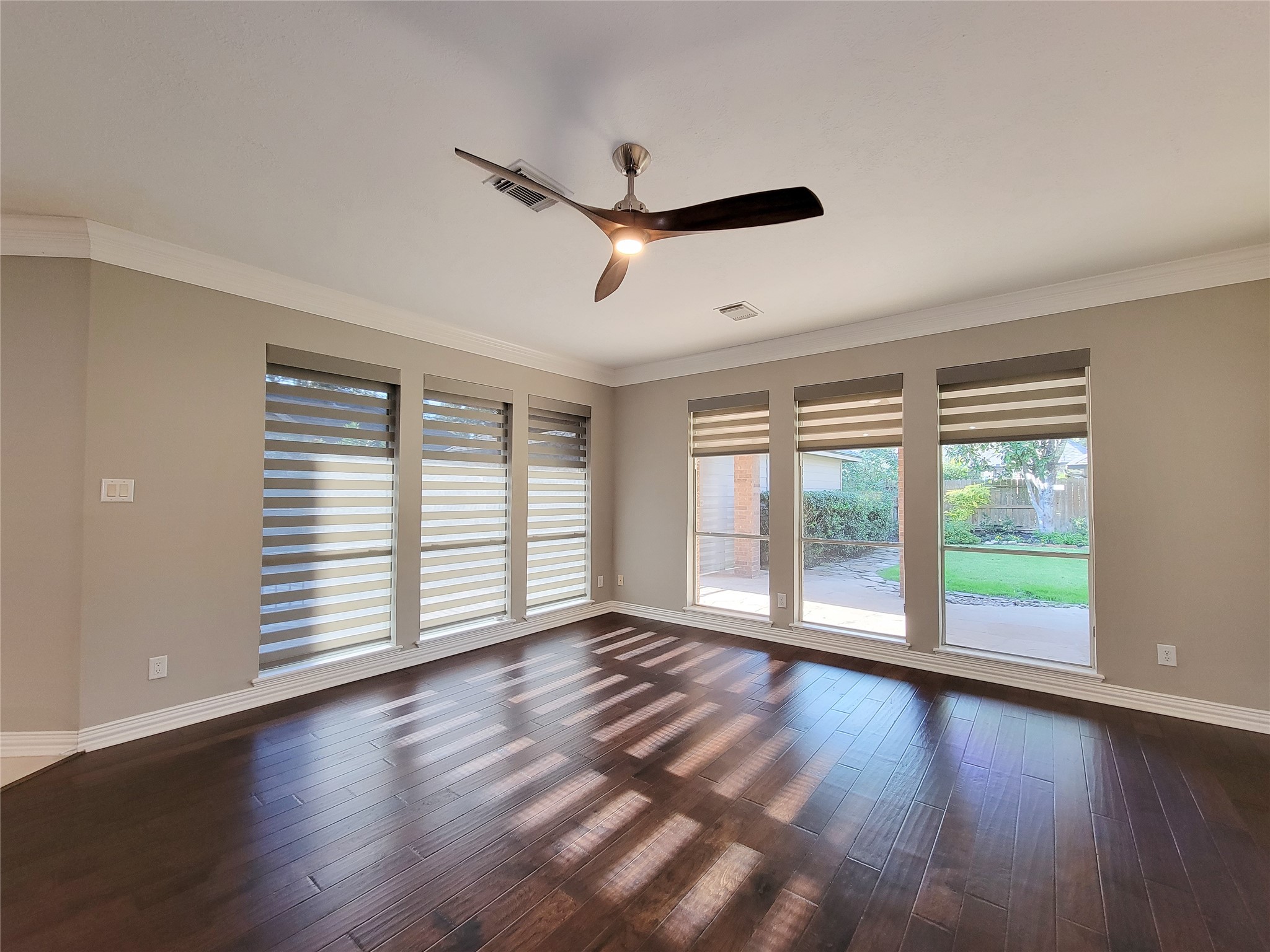5507 Evening Shore Drive Houston, TX 77041 - Photo 18 of 50 a view of empty room with wooden floor and fan