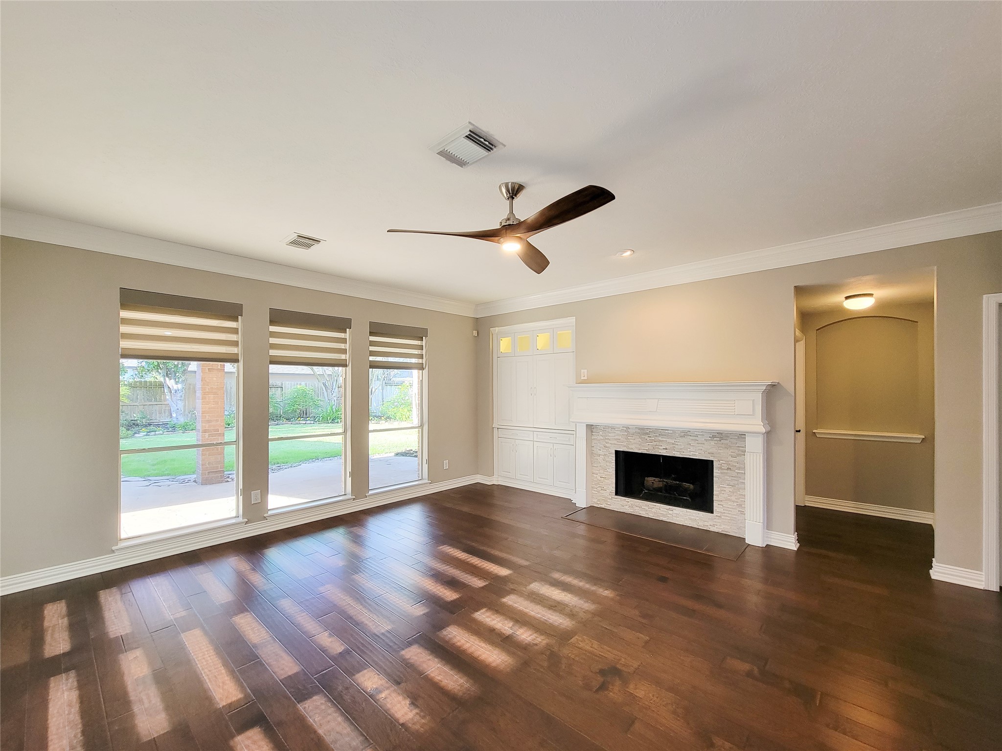 5507 Evening Shore Drive Houston, TX 77041 - Photo 19 of 50 a view of empty room with wooden floor and fireplace