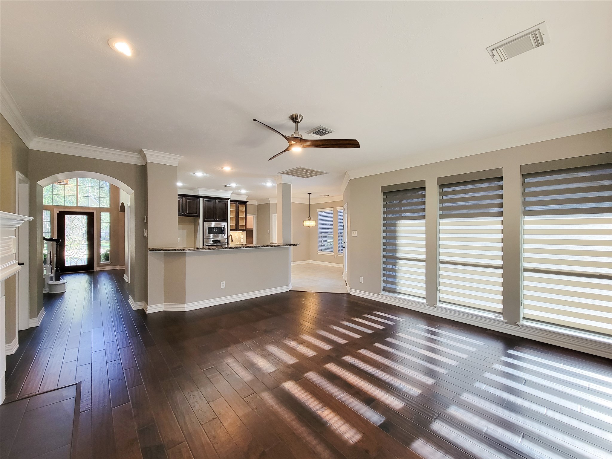 5507 Evening Shore Drive Houston, TX 77041 - Photo 22 of 50 a view of an empty room with a window and wooden floor