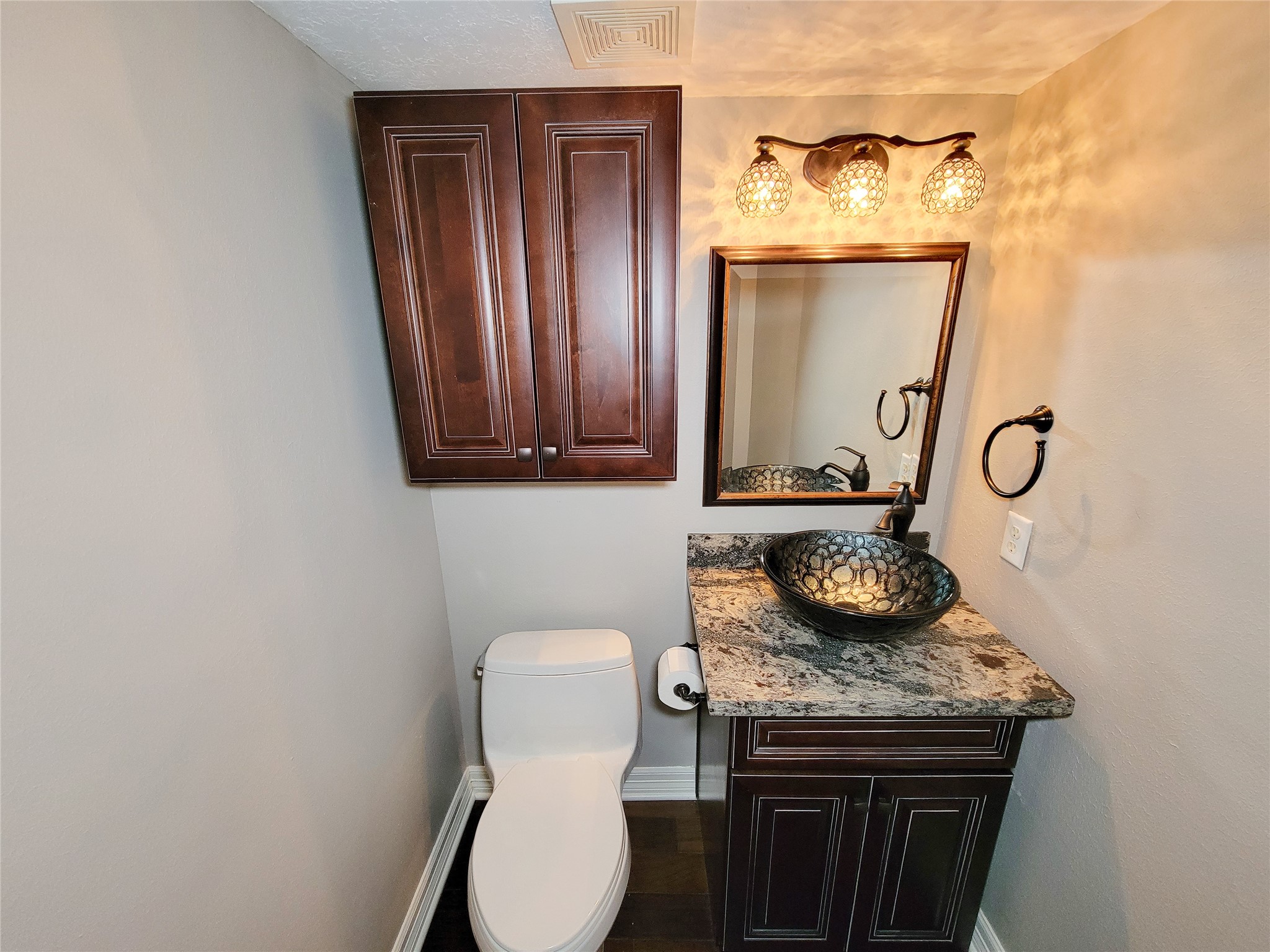 5507 Evening Shore Drive Houston, TX 77041 - Photo 23 of 50 a bathroom with a granite countertop toilet and a sink