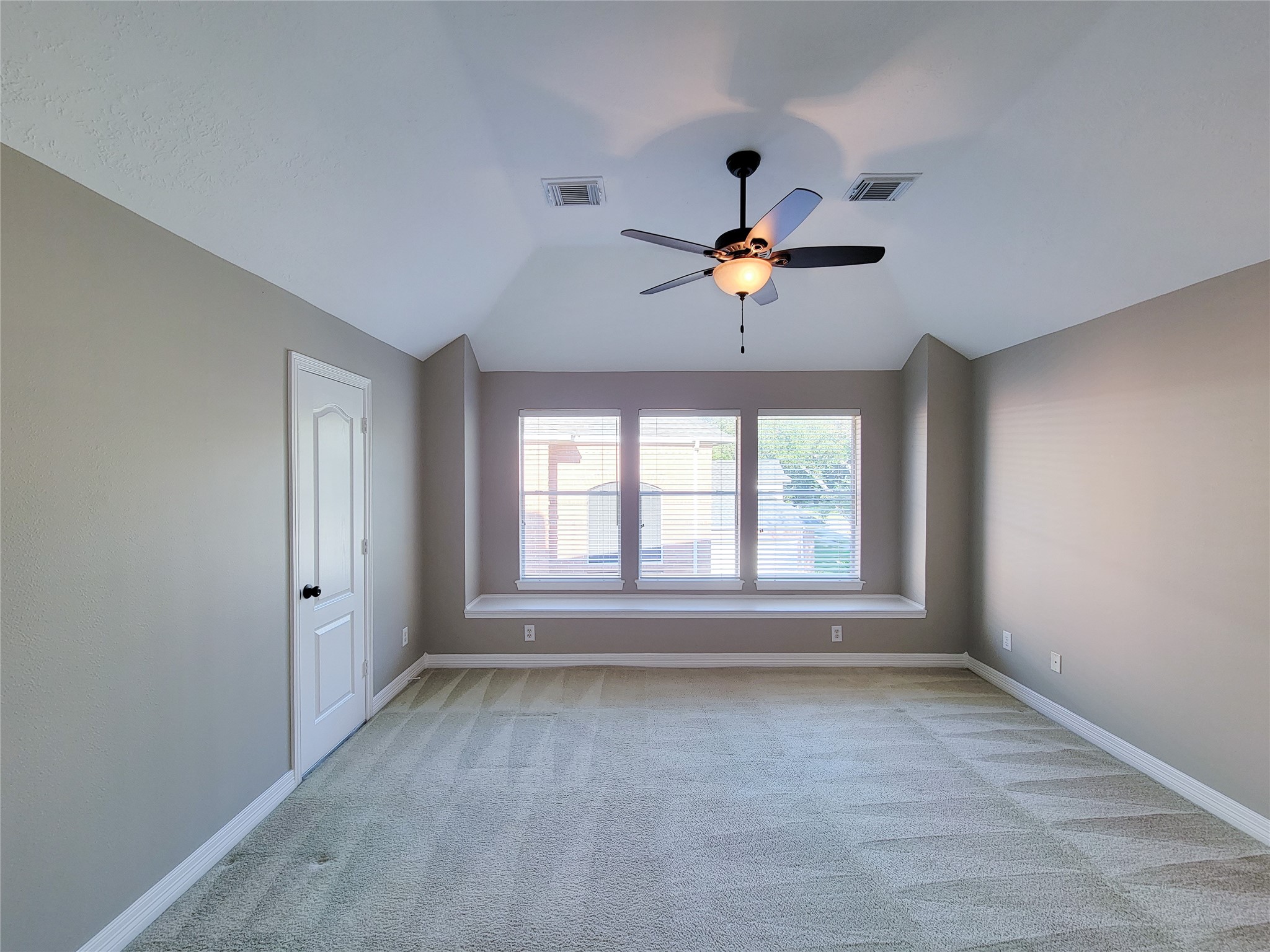 5507 Evening Shore Drive Houston, TX 77041 - Photo 34 of 50 an empty room with chandelier fan and windows