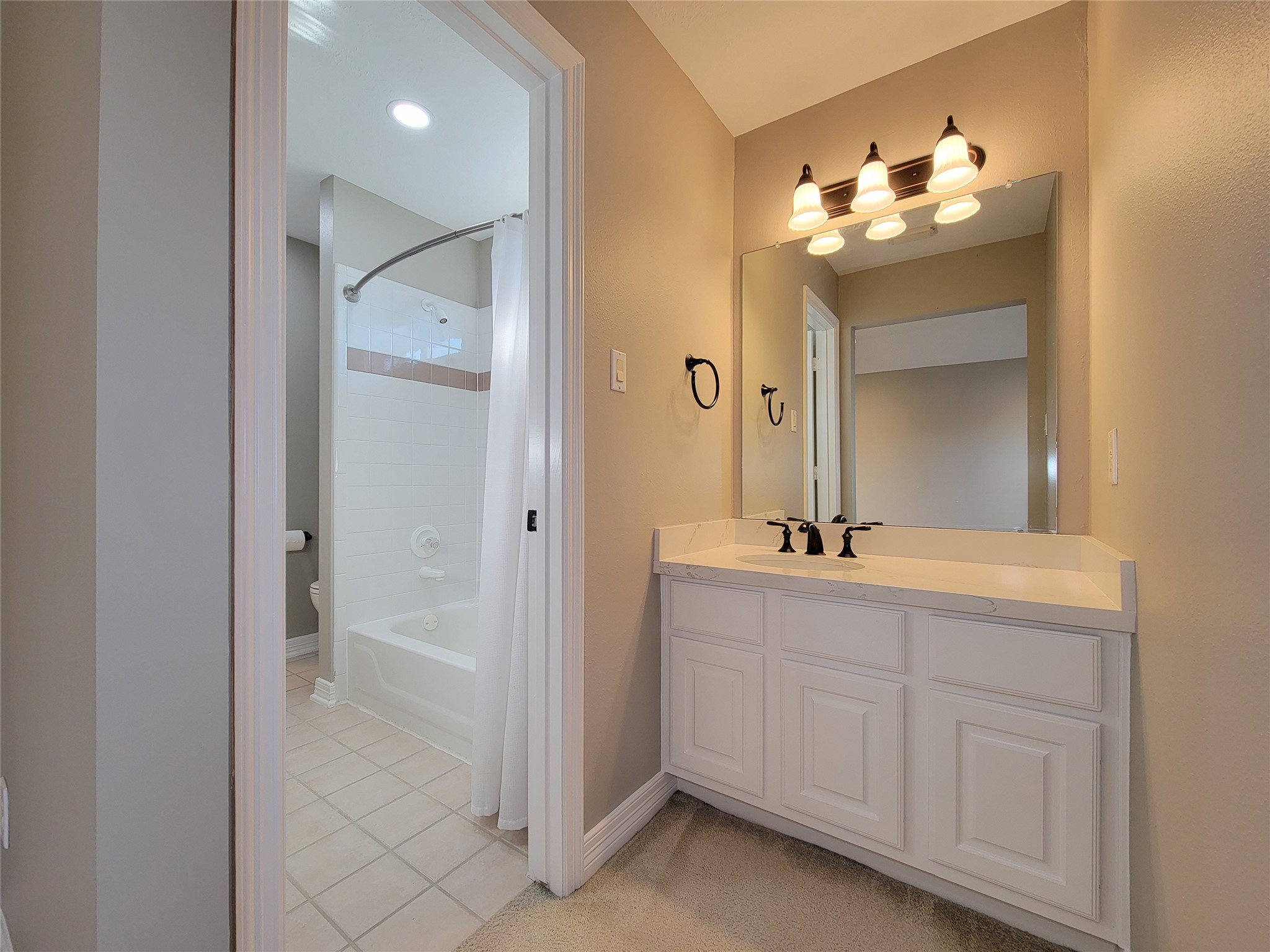 5507 Evening Shore Drive Houston, TX 77041 - Photo 38 of 50 a bathroom with a double vanity sink and a mirror