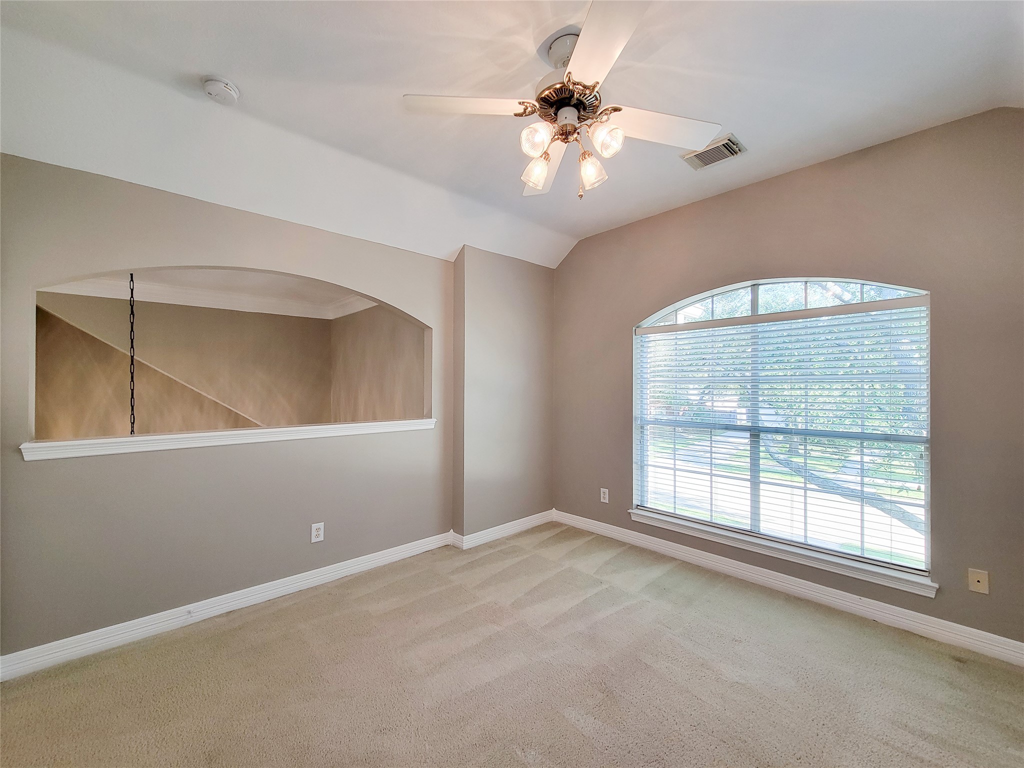 5507 Evening Shore Drive Houston, TX 77041 - Photo 41 of 50 an empty room with windows and fan