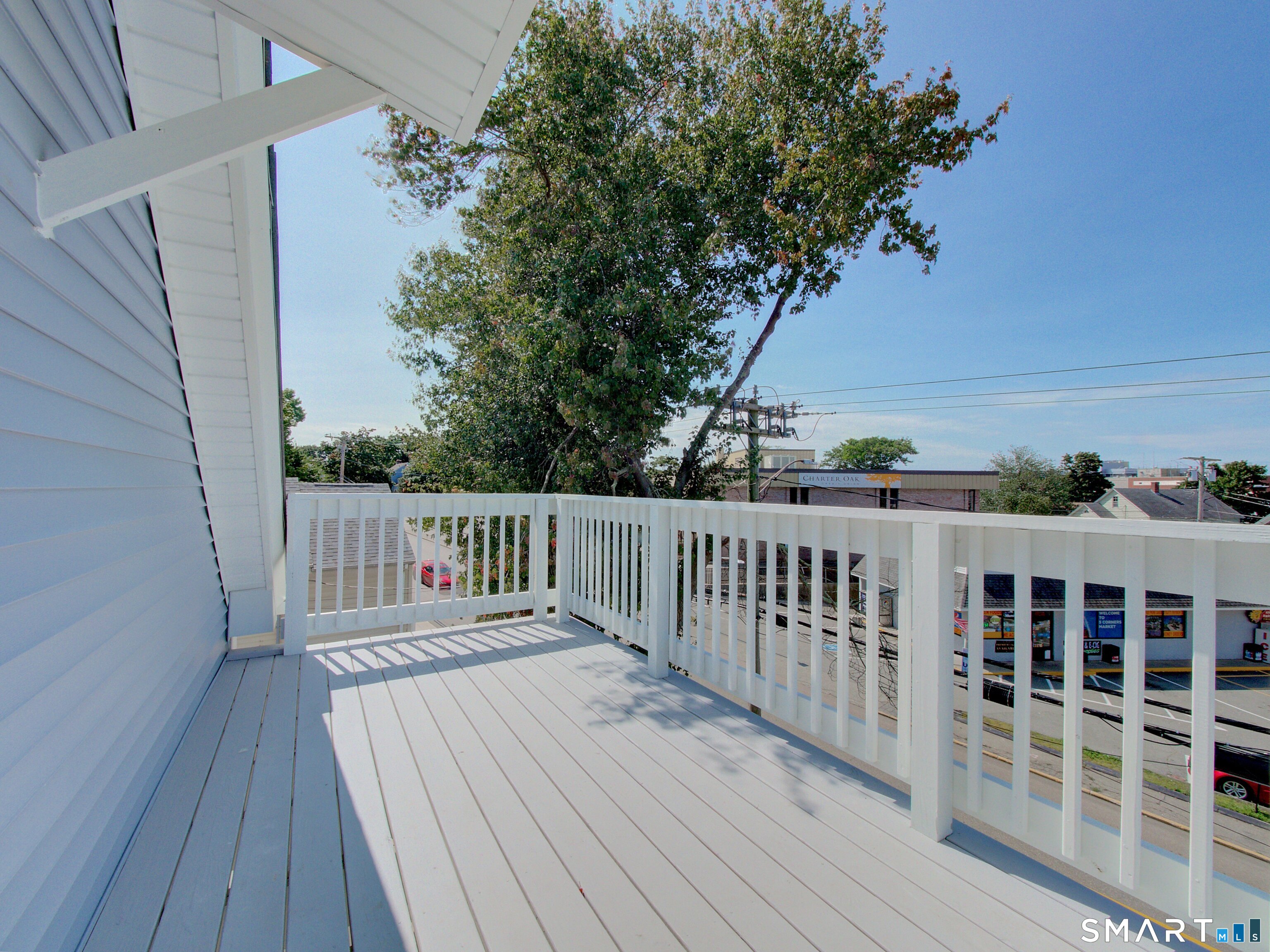 16 Benham Road, Unit D Groton, CT 06340 - Photo 15 of 15 a balcony with wooden floor and fence
