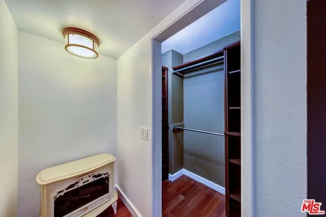 a view of cabinet with wooden floor