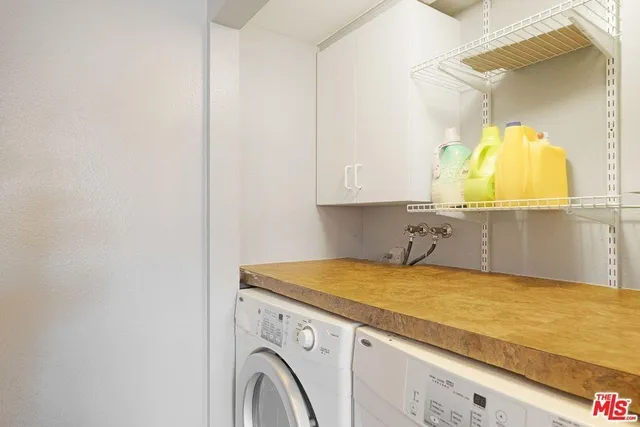 a view of a kitchen with a sink and dishwasher cabinets