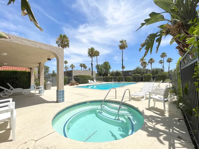 a view of a swimming pool with a lounge chairs