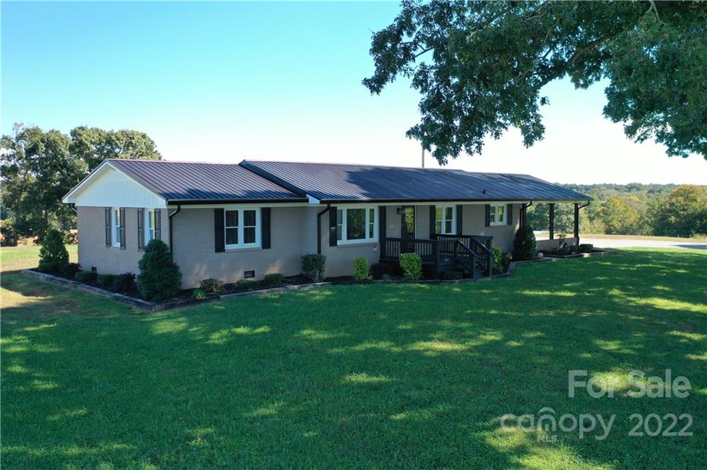147 Stack Road Olin, NC 28660 - Photo 4 of 47 a view of a house with a big yard